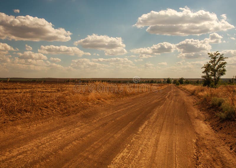 Dirt Road in Countryside on Background of Fields and Sky with Clouds Stock  Image - Image of landscape, beautiful: 195344011