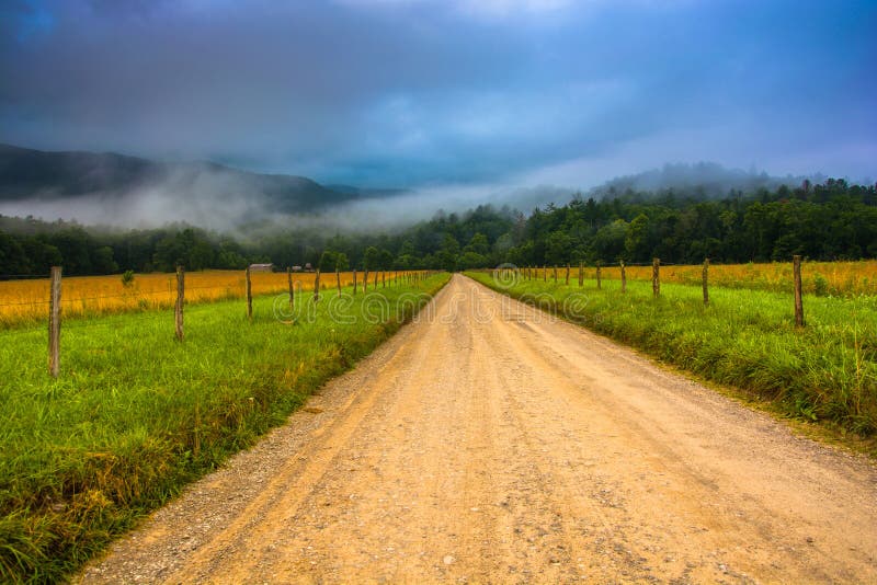 Dirt road and fog in Cade's Cove in the morning, at Great Smoky Mountains National Park, Tennessee