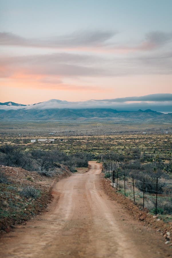 Dirt Road and Mountains at Sunset in the Desert of Eastern Arizona ...