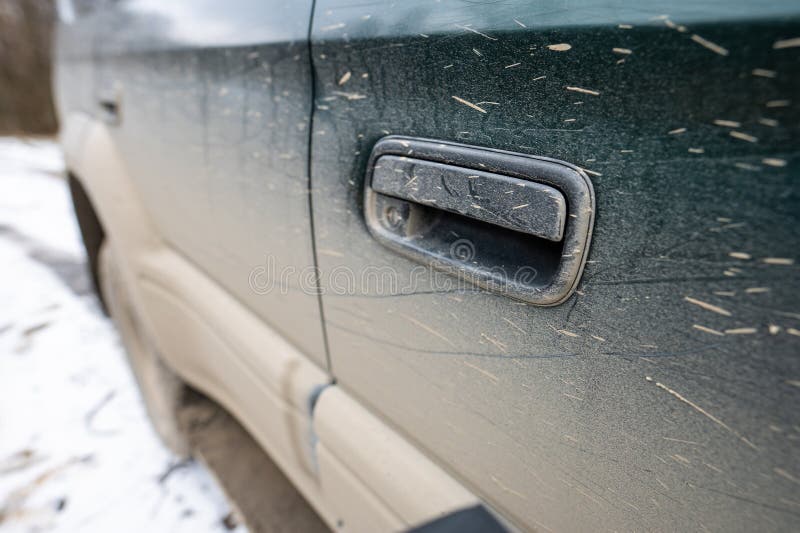 Dirty car side. Splash and texture of mud on a car stock photo