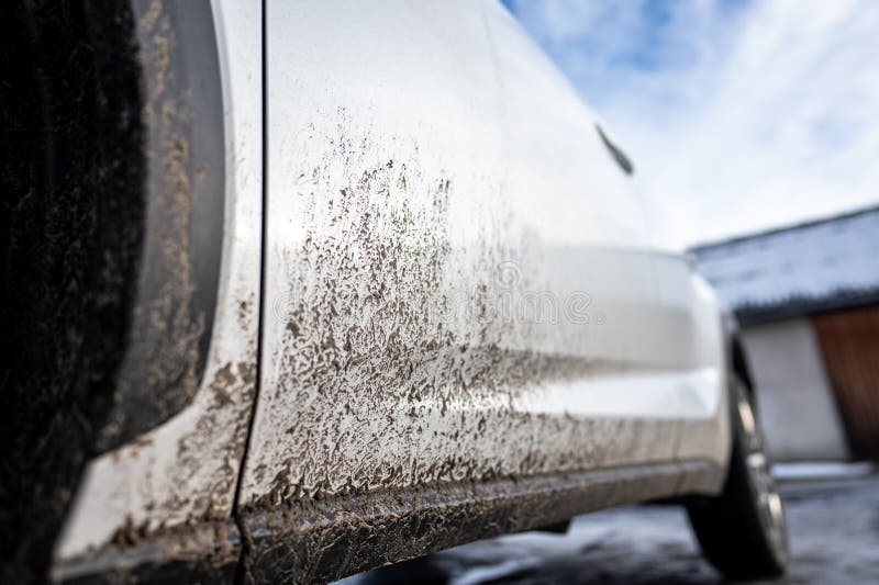 Dirty car side. Splash and texture of mud on a car royalty free stock photography