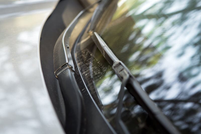Dirty Car Windshield Wipers Covered with a Layer of Dust. Stock Photo