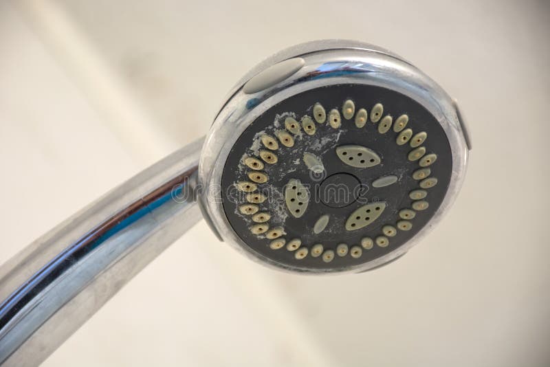 Dirty chrome shower head with limescale that should be cleaned stock images