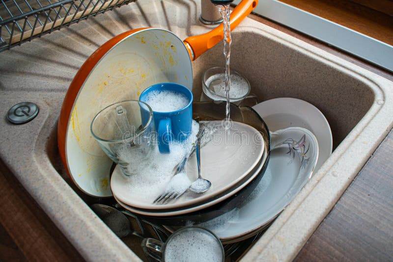 Dirty dishes in sink stock image. Image of hold, housekeeping 190022479