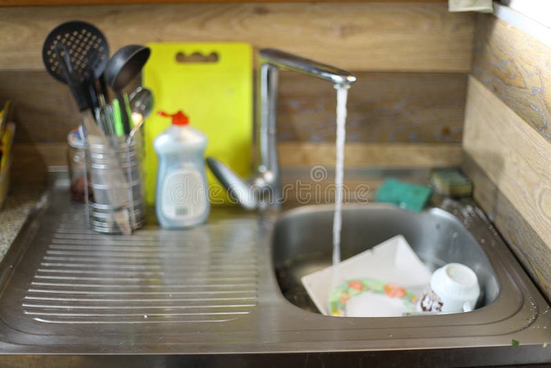 Dirty dishes in the sink stock image. Image of heap, household 69191135