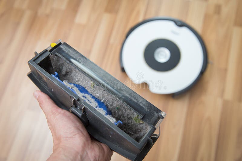 A lot of dirty dust in dust bin from robot vacuum cleaner home cleaning protect from dust allergies