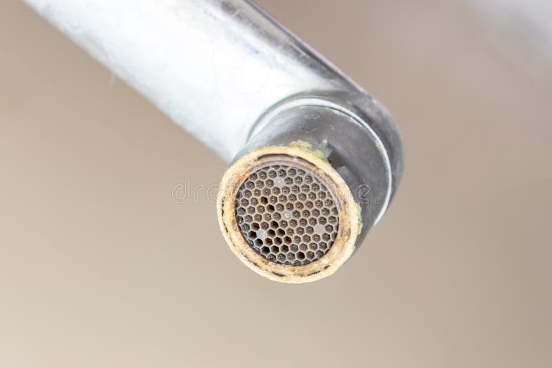 Dirty faucet aerator with limescale, calcified shower water tap with lime scale in bathroom, close up stock photos