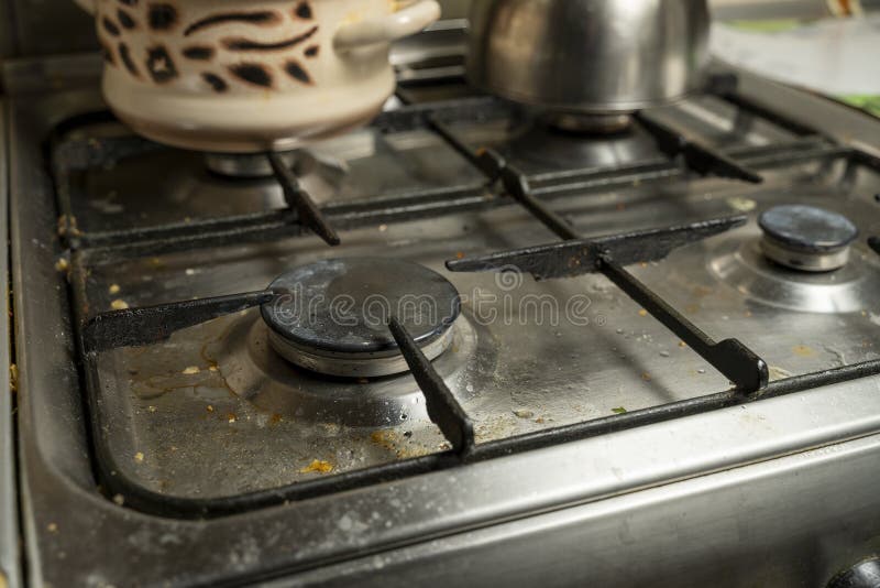 Dirty Gas Stove in the Kitchen with Kitchen Utensils Stock Image