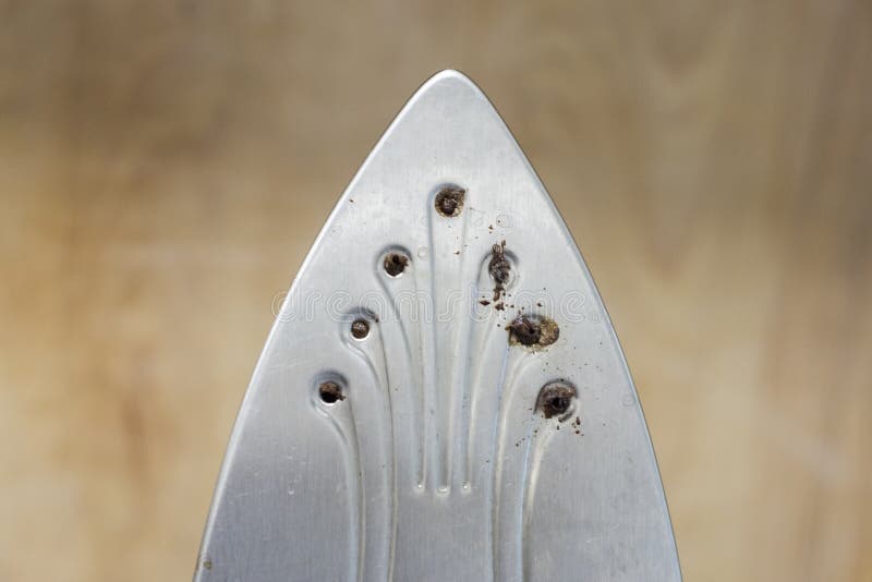 Dirty Ironing System with Clogged Steam Holes. Front View Stock Photo