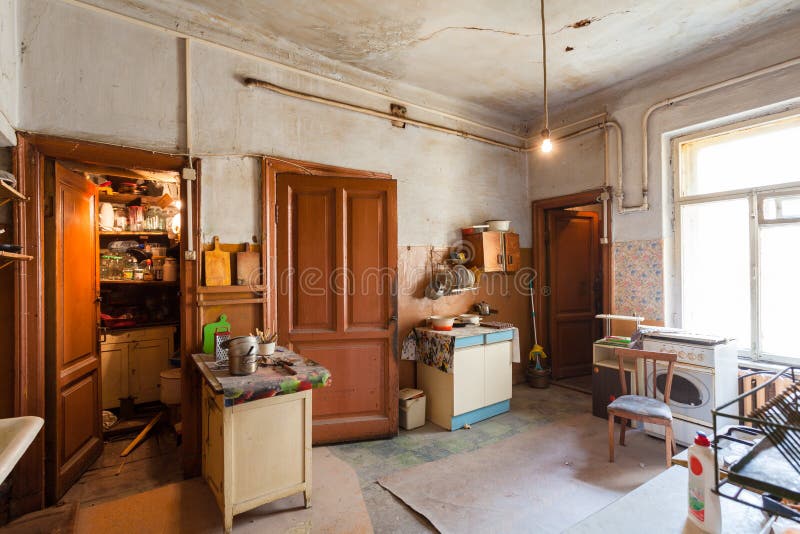 Dirty kitchen with furniture and gas stoves is in the apartment for temporary living existence refugees who were forced to mig stock image Dirty kitchen with furniture and gas stoves is in the apartment for temporary living existence refugees who were forced to mig stock image