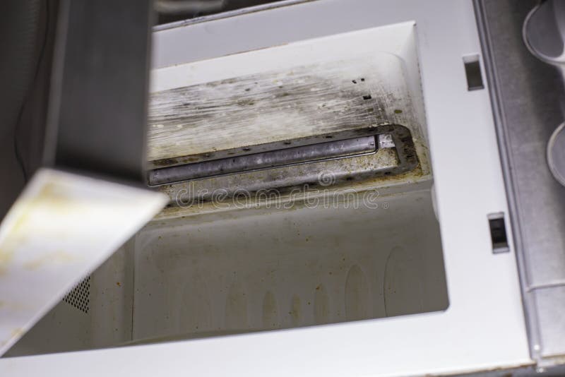 Burnt Microwave after a Fire. Concept Product Insurance, Risk