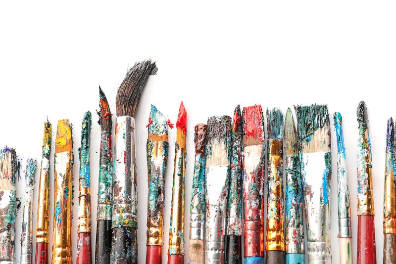 Dirty paint brushes on white background