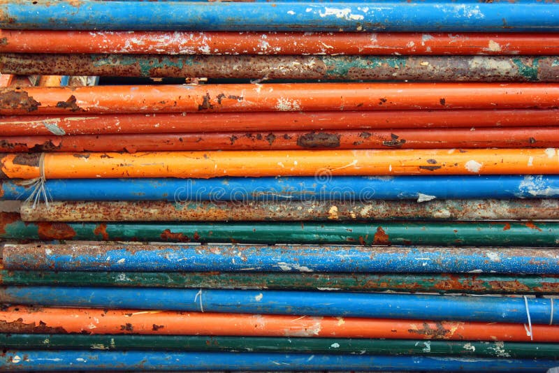 Dirty rusty steel pipes with flaking paint