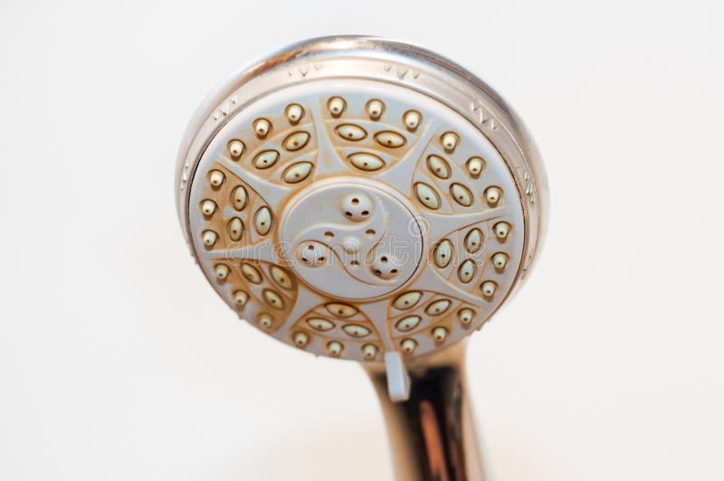Dirty shower head with limescale and rust on it royalty free stock photo