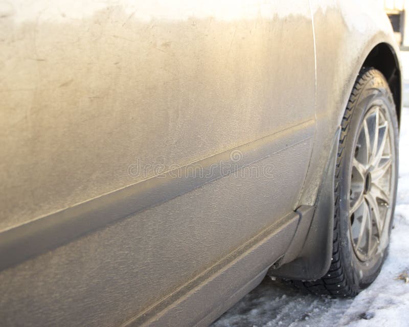 The dirty side of the car, with the front wheel stock images