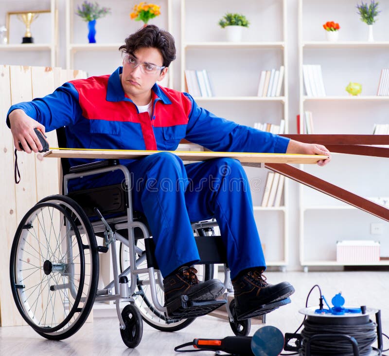 Disabled Carpenter Working With Tools In Workshop Stock 