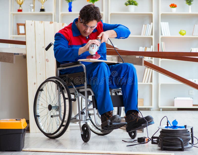 The Disabled Carpenter Working With Tools In Workshop 