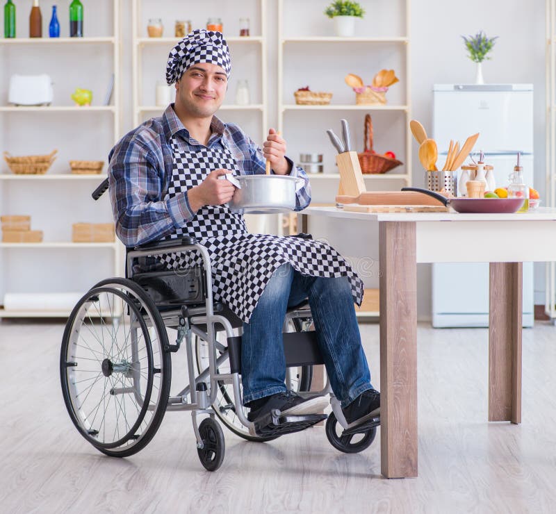 The Disabled Cook on Wheelchair in Cooking Concept Stock Photo Image