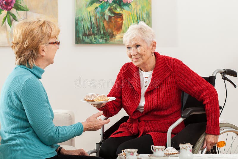 Disabled lady talking with her friend