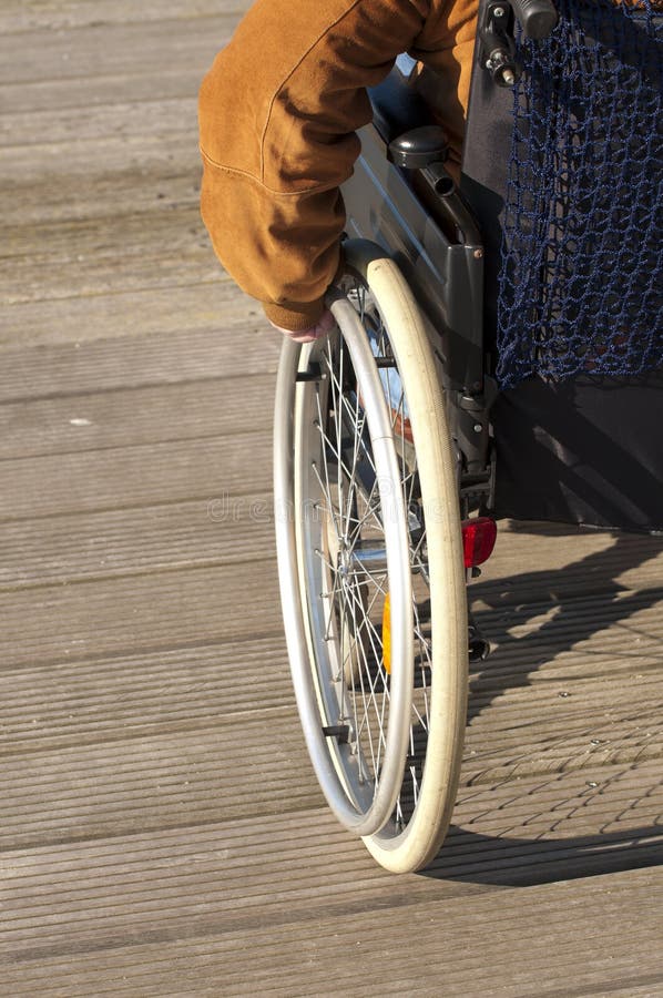 Hand on wheel chair stock photo. Image of grabbing, nobody - 9300942