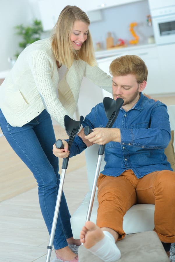 Disabled Man on Crutches with Help Friend Stock Photo - Image of ...