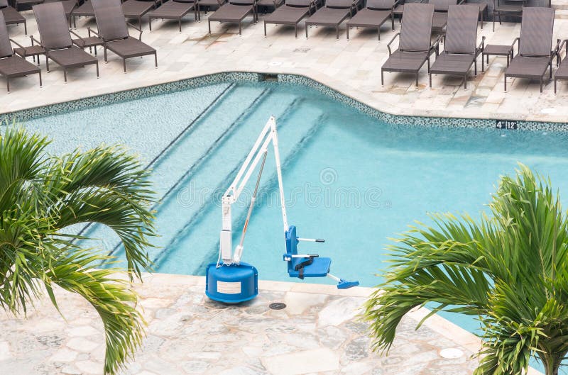 Disabled person pool lift by swimming