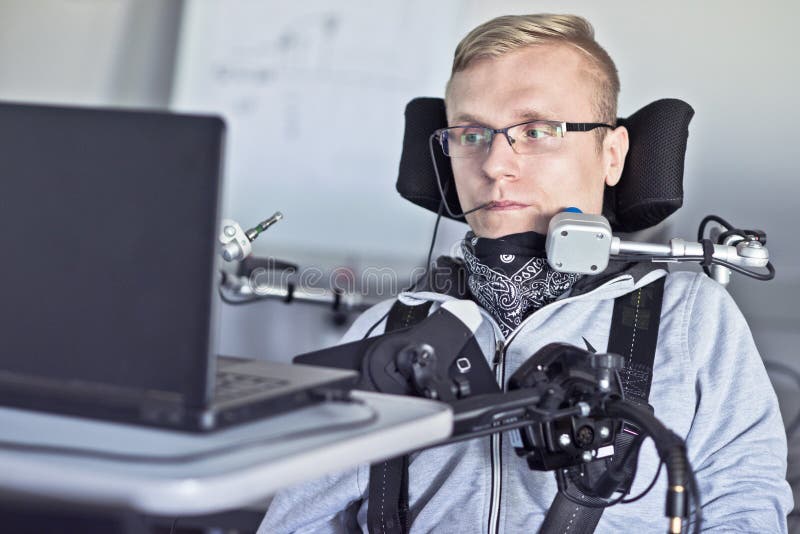 Disabled student working with his computer.