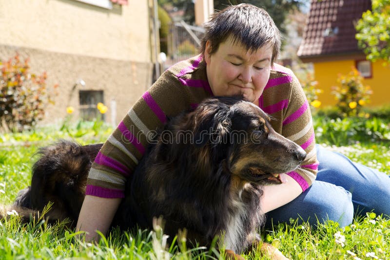 Disabled woman is lying on a lawn