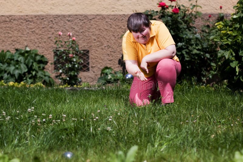 Disabled woman playing bowls