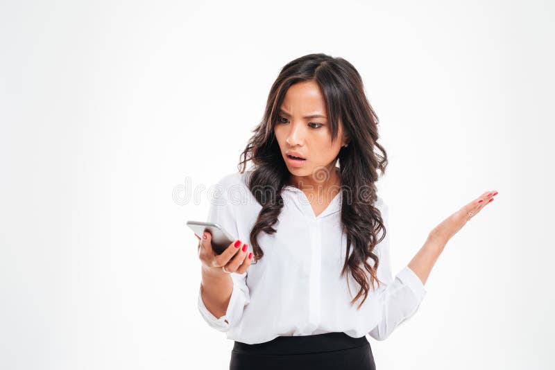 Disappointed confused asian businesswoman using smartphone stock image Disappointed confused asian businesswoman using smartphone stock image