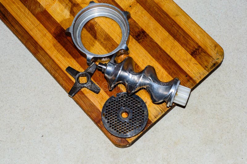 Disassembled Electric Meat Grinder on the Cutting Board Stock Image