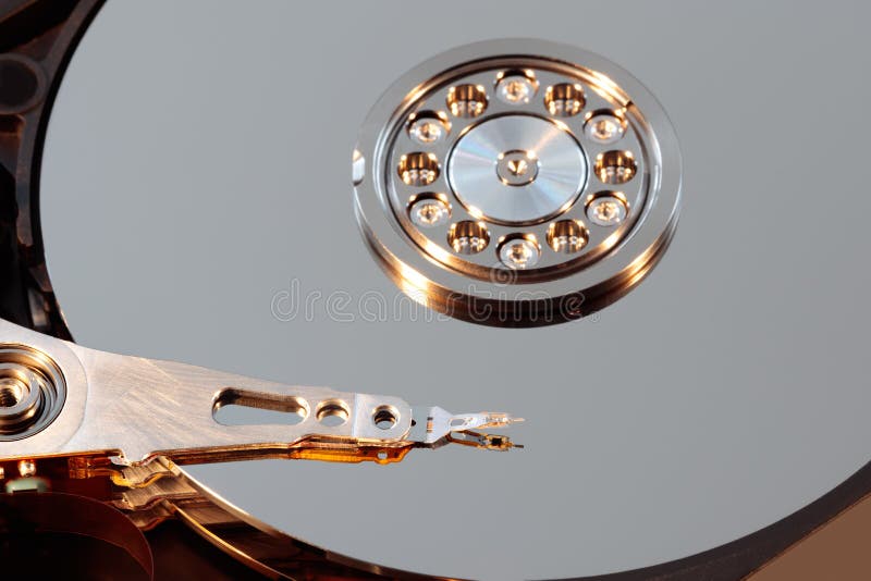 Disassembled hard drive from the computer, hdd with mirror effect. Opened hard drive from the computer hdd with mirror effects. Pa royalty free stock photography Disassembled hard drive from the computer, hdd with mirror effect. Opened hard drive from the computer hdd with mirror effects. Pa royalty free stock photography
