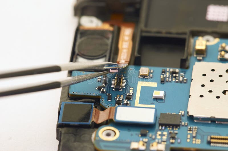Disassembly of smartphone showing electrical board inside. The p royalty free stock image