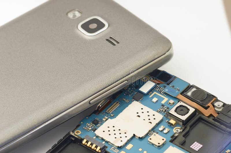 Disassembly of smartphone showing electrical board inside. The p stock images