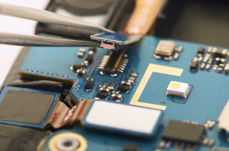 Disassembly of smartphone showing electrical board inside. The p royalty free stock images