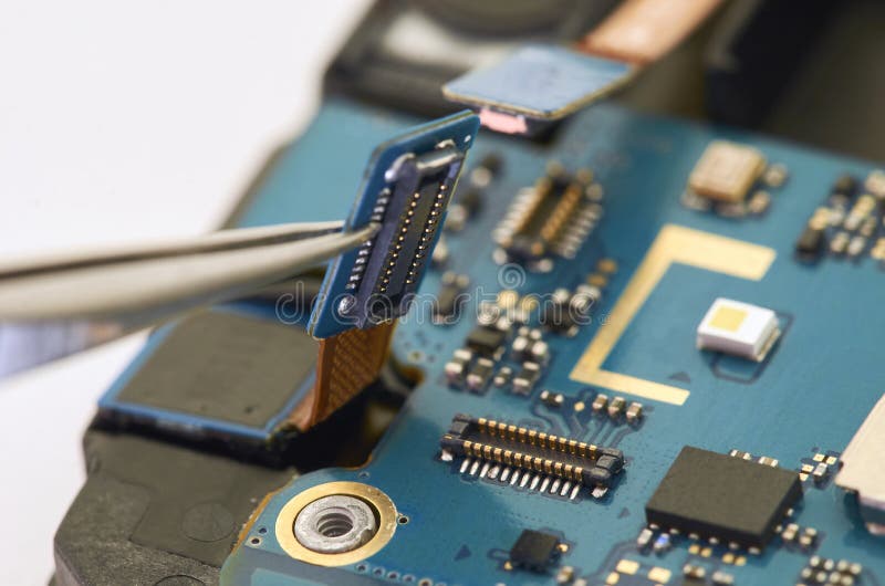 Disassembly of smartphone showing electrical board inside. The p royalty free stock image