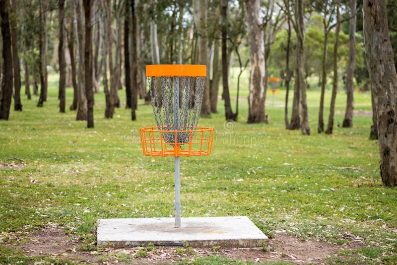 Disc golf basket in a park stock image. Image of colorful 272327239