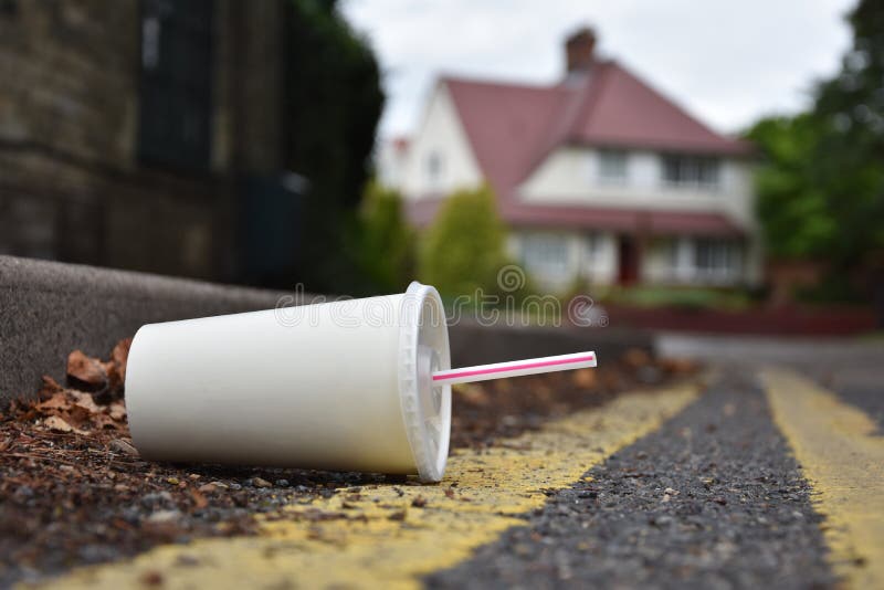 Discarded Drinks Container Lying at the Edge of an Urban Street Stock ...