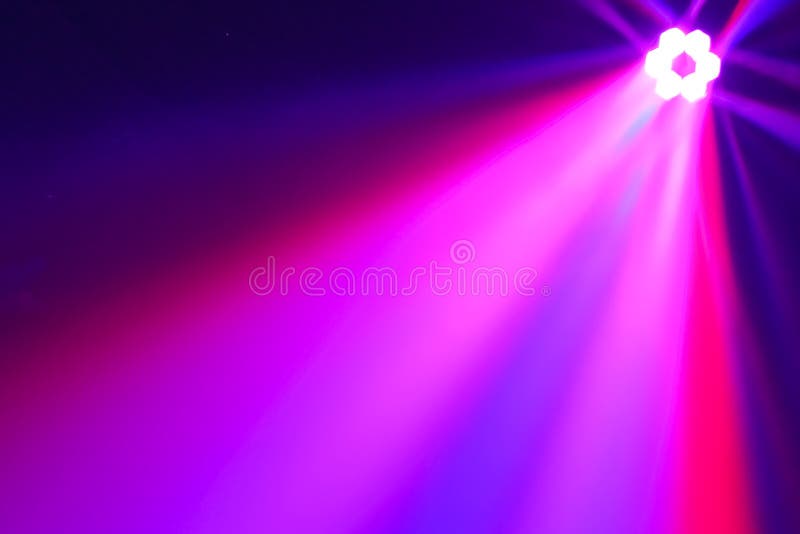 Disco rays beams background of spotlight sparkle on dark background in night club royalty free stock image