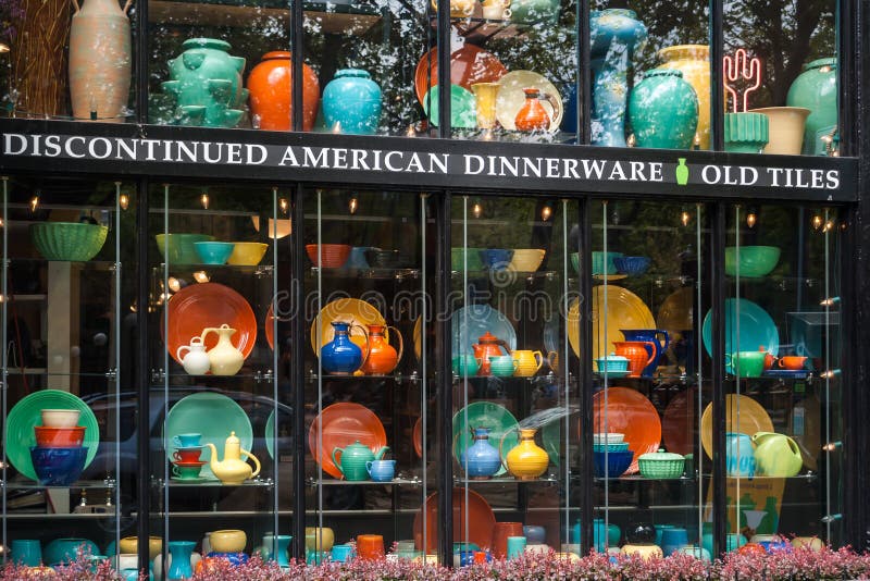 Discontinued American dinnerware and old tiles on display in shopping window on Pioneer Square in Seattle. Discontinued American dinnerware and old tiles on display in shopping window on Pioneer Square in Seattle.