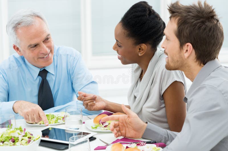 Discussing of Work at Lunch Stock Photo Image of businesspeople