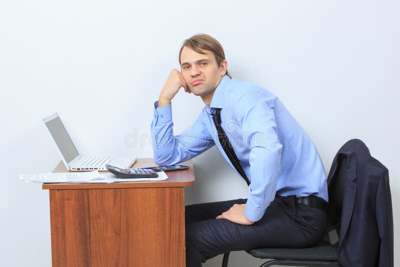 Disgruntled manager at his desk