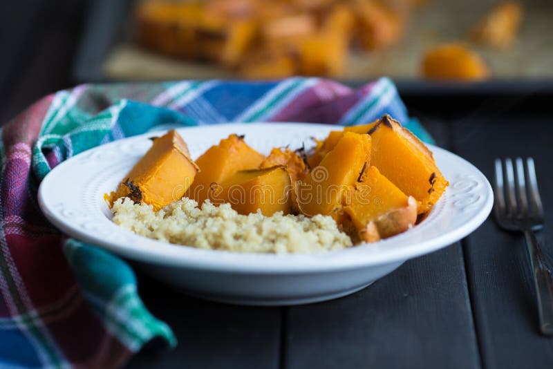 A dish of cooked pumpkin and quinoa stock photos A dish of cooked pumpkin and quinoa stock photos