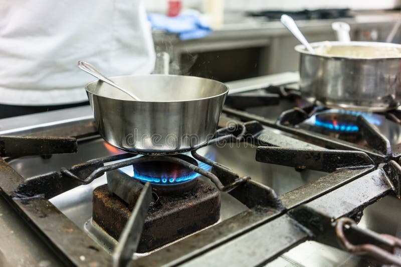 Dish on gas stove in restaurant or hotel kitchen Stock Image Everypixel