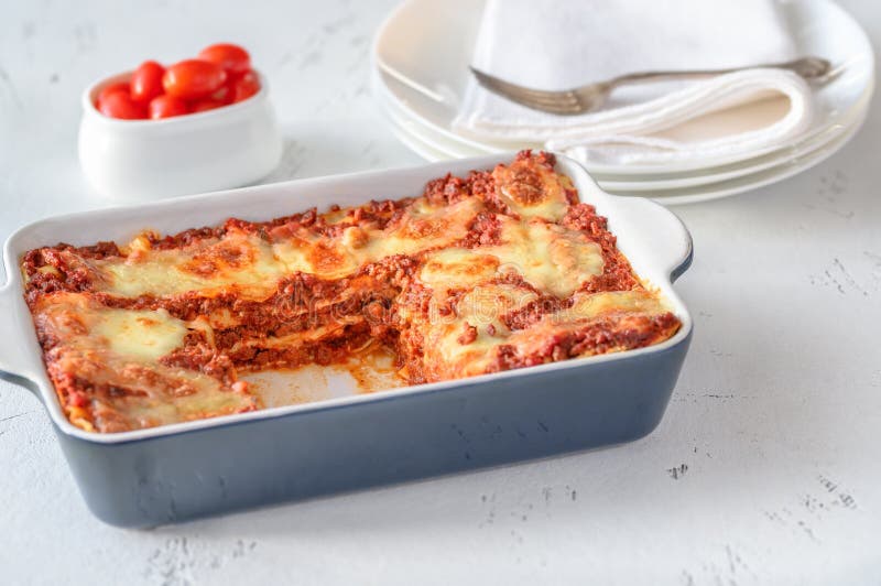Dish of Lasagne Cooking Inside Oven. Baking Tray with Spinach Lasagna in Oven Stock Image