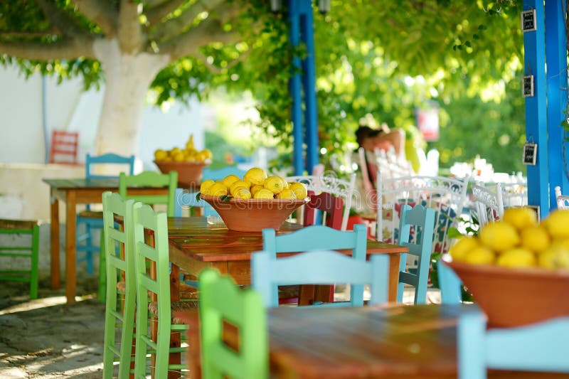 A dish of lemons in typical greek outdoor cafe