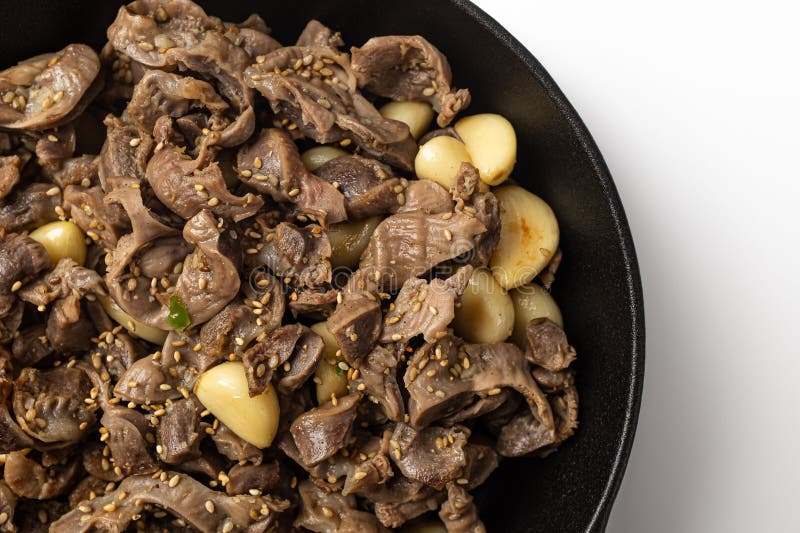 Stir-fried Chicken Gizzards and Garlic on a White Background Stock