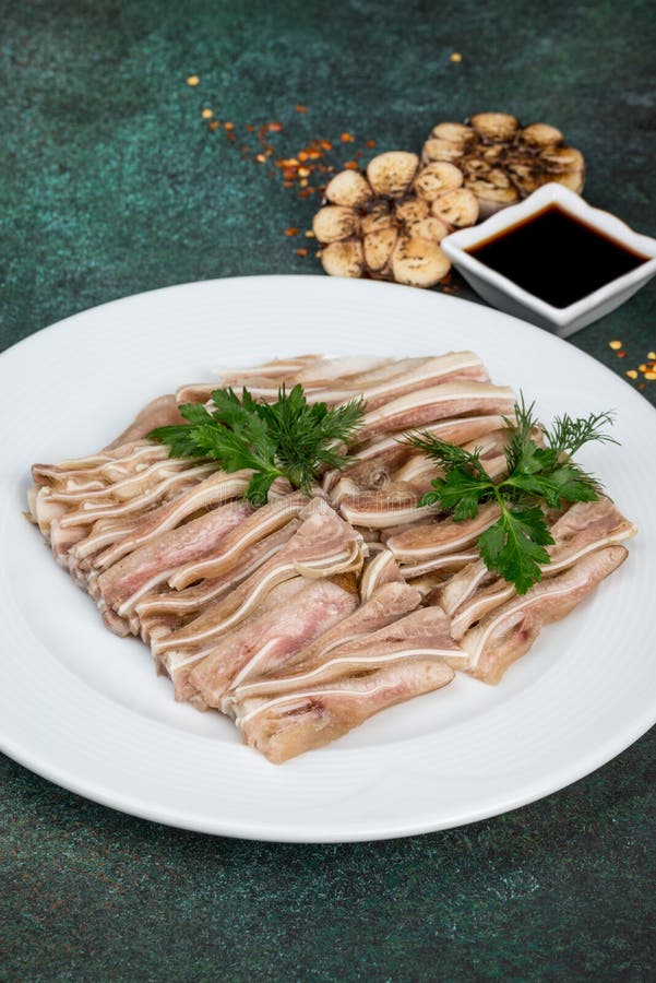 Dish of Pork Ears Sliced on a White Plate Stock Image Image of