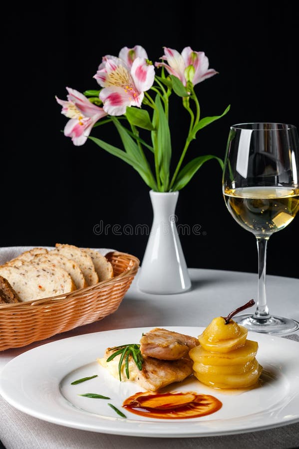 Dish at the restaurant is a roasted pike perch with caramel and white wine royalty free stock photos