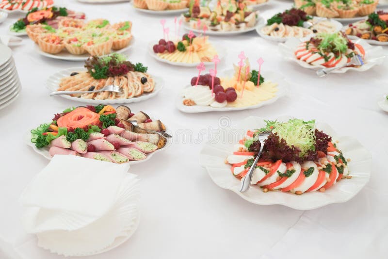 Dishes and food on the served table stock image